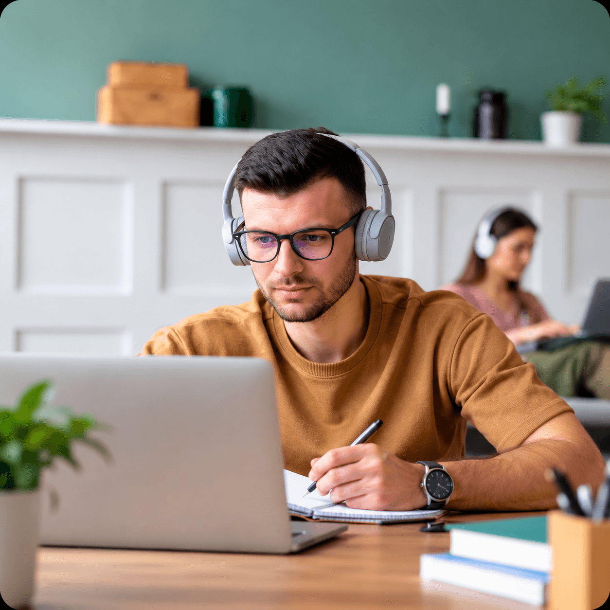 Student attending a live online class with headphones